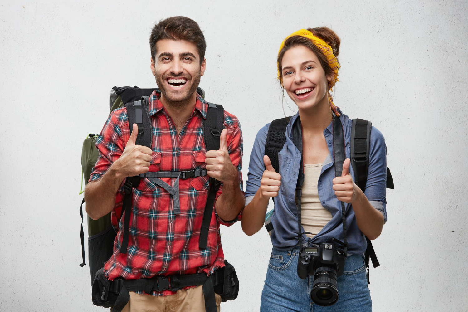 Young tourists couple with equipment